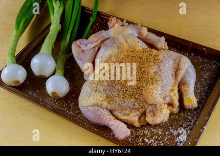 close up of a marinated whole chicken marinated whole chicken Stock Photo