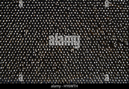 Dark worn rusty metal nails texture background. Stock Photo