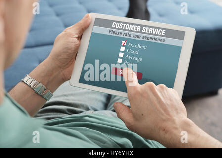 Online customer service satisfaction survey on a digital tablet Stock Photo