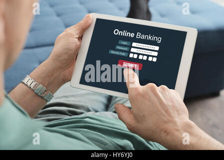Male hands using online banking on touch screen device Stock Photo