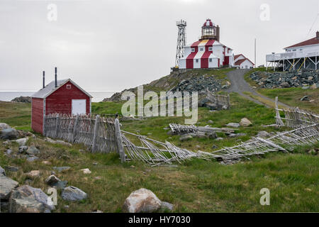 Cape Bonavista lighthouse with red shed and stick fence, Newfoundland Stock Photo
