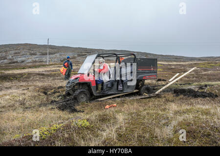 Peat bog versus the ATV, Quirpon Island, Newfoundland Stock Photo