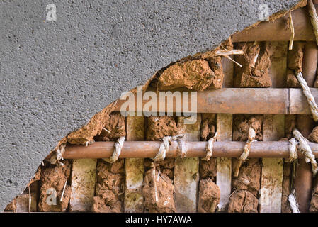 Japanese wall structure close up .The wall surface is cement and inside is clay and bamboo with rope pattern Stock Photo