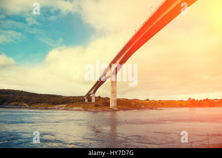 Bridge over fjord at sunset. Whirlpools of the maelstrom of Saltstraumen, Norway Stock Photo