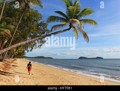 Excerpt from the Sunday morning walk on Clifton Beach heading towards Palm Cove with Double Island offshore at the top end - landscape orientation Stock Photo