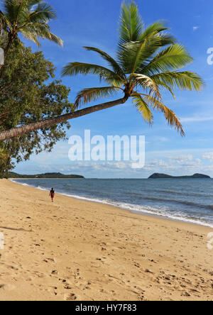 Excerpt from the Sunday morning walk on Clifton Beach heading towards Palm Cove with Double Island offshore at the top end - portrait orientation Stock Photo
