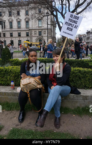 London, UK. 1st April, 2017.  Protesteors rally  Against Housing Benefit Cuts For 18-21 Year Olds demand Theresa May to stop Housing Benefit Cuts  and gives us back our home in Parliament square,London,UK. Credit: See Li/Alamy Live News Stock Photo