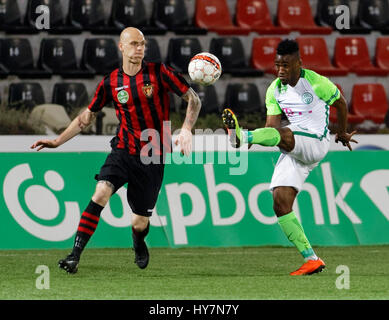 Budapest, Hungary. 1st April, 2017. Botond Barath (L) of Budapest Honved competes for the ball with Amadou Moutari (R) of Ferencvarosi TC during the Hungarian OTP Bank Liga match between Budapest Honved and Ferencvarosi TC at Bozsik Stadium on April 1, 2017 in Budapest, Hungary. Credit: Laszlo Szirtesi/Alamy Live News Stock Photo
