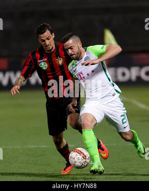 Budapest, Hungary. 1st April, 2017. Davide Lanzafame (L) of Budapest Honved competes for the ball with Endre Botka #21 of Ferencvarosi TC during the Hungarian OTP Bank Liga match between Budapest Honved and Ferencvarosi TC at Bozsik Stadium on April 1, 2017 in Budapest, Hungary. Credit: Laszlo Szirtesi/Alamy Live News Stock Photo