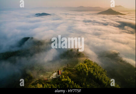 Huoshan. 2nd Apr, 2017. Aerial photo taken on April 2, 2017 shows the sea of clouds over Wangjiachong Village near Dabie Mountains in Huoshan County, east China's Anhui Province. Credit: Xu Cheng/Xinhua/Alamy Live News Stock Photo