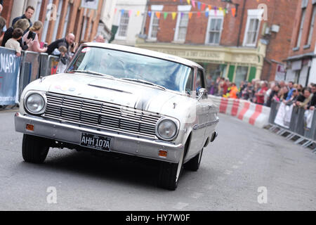 Bromyard Speed Festival, Herefordshire, UK - Sunday 2nd April 2017 - Vintage and classic cars roar through the town centre of Bromyard as fans watch the 2nd Bromyard Speed Festival. The photo shows a classic Ford Falcon Sprint car. Photo Steven May / Alamy Live News Stock Photo