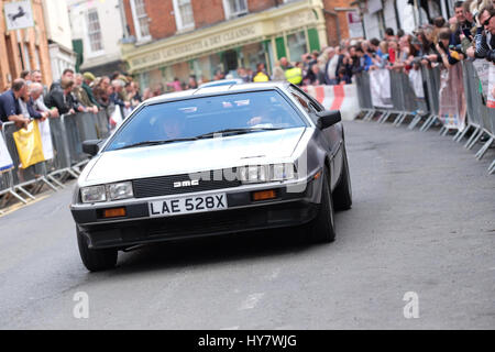 Bromyard Speed Festival  Herefordshire, UK - Sunday 2nd April 2017 - Vintage and classic cars roar through the town centre of Bromyard as fans watch the 2nd Bromyard Speed Festival. The photo shows a 1981 Delorean DMC12 sports car. Photo Steven May / Alamy Live News Stock Photo
