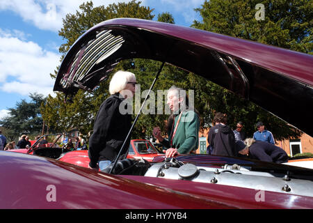 Bromyard Speed Festival, Herefordshire, UK - Sunday 2nd April 2017 - Vintage and classic car show - Female car enthusiasts discuss the merits of classic Jaguar cars at the Bromyard Speed Festival. Photo Steven May / Alamy Live NewsFemale car Stock Photo