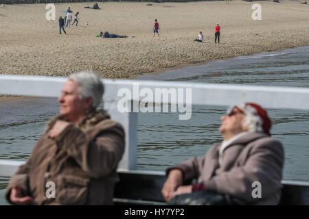 Gdansk, Poland. 02nd Apr, 2017. People enjoing warm weather, at the Gdansk Brzezno Pier on the Baltic sea coast are seen in Gdansk, Poland on 2 April 2017 . With temperatures close to 20 Celsius degrees, spring definetly has come to Poland. Meteorologists predict next few days of warm weather in Poland Credit: Michal Fludra/Alamy Live News Stock Photo