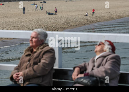 Gdansk, Poland. 02nd Apr, 2017. People enjoing warm weather, at the Gdansk Brzezno Pier on the Baltic sea coast are seen in Gdansk, Poland on 2 April 2017 . With temperatures close to 20 Celsius degrees, spring definetly has come to Poland. Meteorologists predict next few days of warm weather in Poland Credit: Michal Fludra/Alamy Live News Stock Photo