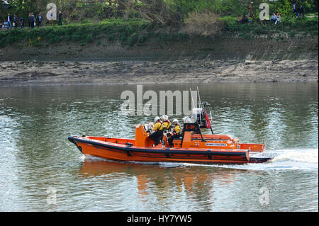 London, UK. 02nd Apr, 2017. In the build up to the start of the 2017 Cancer Research Boat Race, the Thames was busy with several vessels including rigid inflatable police motor boats, RNLI Lifeboats and the Queen's Row Barge 'Gloriana' which was accompanied by a flotilla of traditional rowing boats. Credit: Michael Preston/Alamy Live News Stock Photo