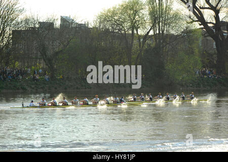 London, UK. 2nd April, 2017. Oxford rowing hard and just in front of Cambridge as the University Boat race passes underneath Hammersmith Bridge.  The Boat Race is an annual contest between two rowing crews from Oxford and Cambridge universities and takes place close to Easter each year on the River Thames in West London between Putney and Mortlake. First raced in 1829, The Cancer Research UK Boat Race is amongst the oldest sporting events in the world.   Credit: Michael Preston/Alamy Live News Stock Photo