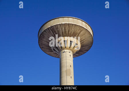 concrete water tower against blue sky Stock Photo