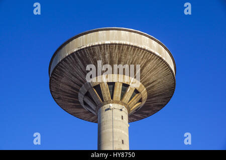 concrete two water towers against blue sky Stock Photo