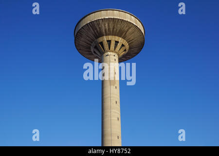 concrete two water towers against blue sky Stock Photo