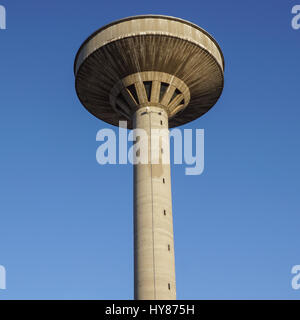 concrete two water towers against blue sky Stock Photo