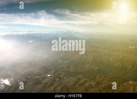 Aerial view of the mountains in the clouds. Stock Photo