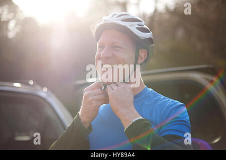 A man prepares to go mountain biking Stock Photo
