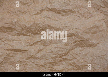 Wrinkled kraft paper. Top view brown crumpled paper background texture Stock Photo