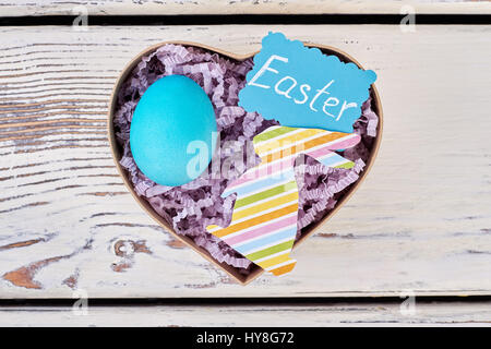 Gift box, Easter greeting card. Blue painted chicken egg. Stock Photo