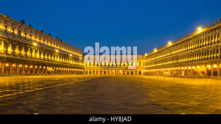 Panorama of illuminated and deserted St Marks Square (Piazza San Marco) in early morning, Venice Stock Photo