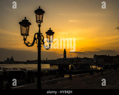 Sunset over St Marks Square (San Marco) and Campanile Bell Tower  in Venice Stock Photo