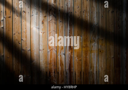 Light beam on a dark wooden background Stock Photo
