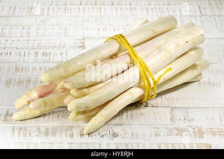 bundle of white asparagus on wooden background Stock Photo