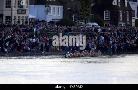 Cambridge Women's crew in action watched by spectators on the riverbank during the Women's Boat Race on the River Thames, London. PRESS ASSOCIATION Photo. Picture date: Sunday April 2, 2017. See PA story ROWING Boat Race. Photo credit should read: Steven Paston/PA Wire Stock Photo