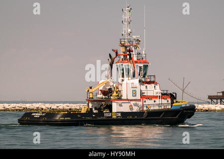 Venice, Italy - May 20, 2016: Tugboat used to tow the cruise ships in the lagoon to St. Mark's Square. Stock Photo
