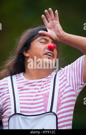 A Red Nose actor - performer out side of Teatro Juarez in Guanajuato. México. Stock Photo