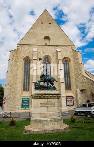 Statue of Saint George fighting the dragon in front of Transylvanian Reformed Calvinist Church in Cluj Napoca, second most populous city in Romania Stock Photo