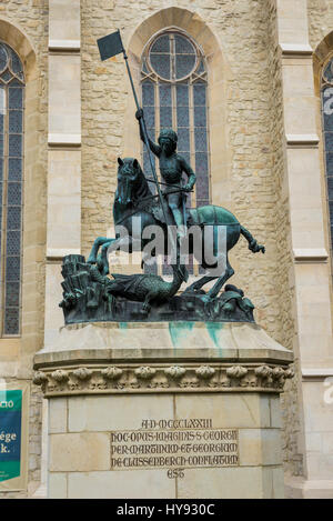 Statue of Saint George fighting the dragon in front of Transylvanian Reformed Calvinist Church in Cluj Napoca, second most populous city in Romania Stock Photo