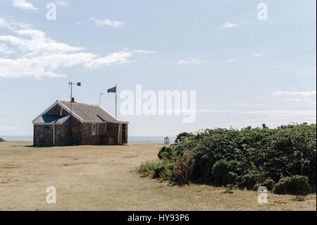National Coastwatch Station at Worms Head on the National Trust coastal path in the Gower peninsula, South Wales. Stock Photo