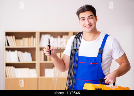 Man doing electrical repairs at home Stock Photo