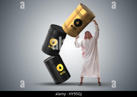 Arab businessman holding oil barrel Stock Photo