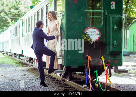 Couple on a ladder of wagon Stock Photo