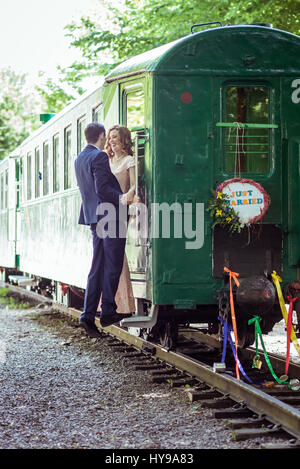 Couple on a ladder of wagon Stock Photo