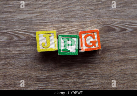 Wood Block letters forming the abbreviation JPEG Stock Photo