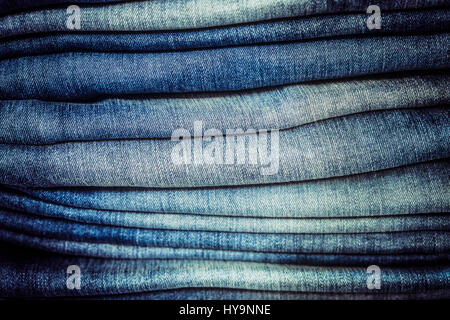 Close-up detail of blue jeans stack with selective focus Stock Photo