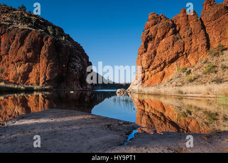 Reflections of rock formations at Glen Helen Gorge water hole in Northern Territory Central Australia Stock Photo