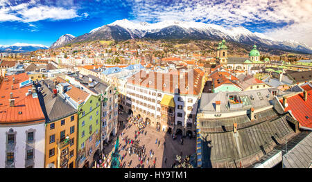 INNSBRUCK, AUSTRIA - March 11, 2017 - People in Innsbruck city center under Stadtturm tower. It is capital sity of Tyrol in western Austria, Europe. Stock Photo