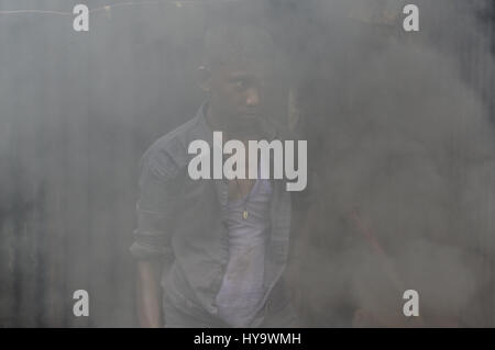 April 2, 2017 - Dhaka, Bangladesh - A child labor Yeachin (13), works in smoke at Keraniganj dockyard. (Credit Image: © Md. Mehedi Hasan via ZUMA Wire) Stock Photo