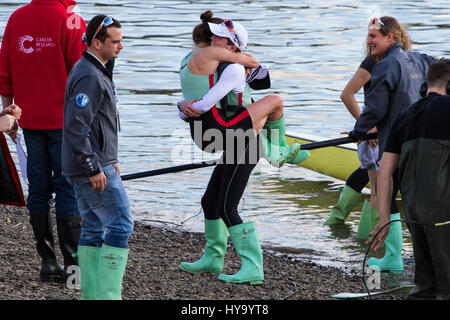 London, UK. 02nd Apr, 2017. London, April 2nd 2017. The winners celebrate and the losers commiserate at the finish of the 163rd running, and 72nd for women, of the Cancer Research UK Boat Race between Oxford and Cambridge Universities on the River Thames between Putney Bridge and Chiswick Bridge. Credit: Paul Davey/Alamy Live News Stock Photo