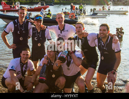 London, UK. 02nd Apr, 2017. London, April 2nd 2017. The winners celebrate and the losers commiserate at the finish of the 163rd running, and 72nd for women, of the Cancer Research UK Boat Race between Oxford and Cambridge Universities on the River Thames between Putney Bridge and Chiswick Bridge. Credit: Paul Davey/Alamy Live News Stock Photo